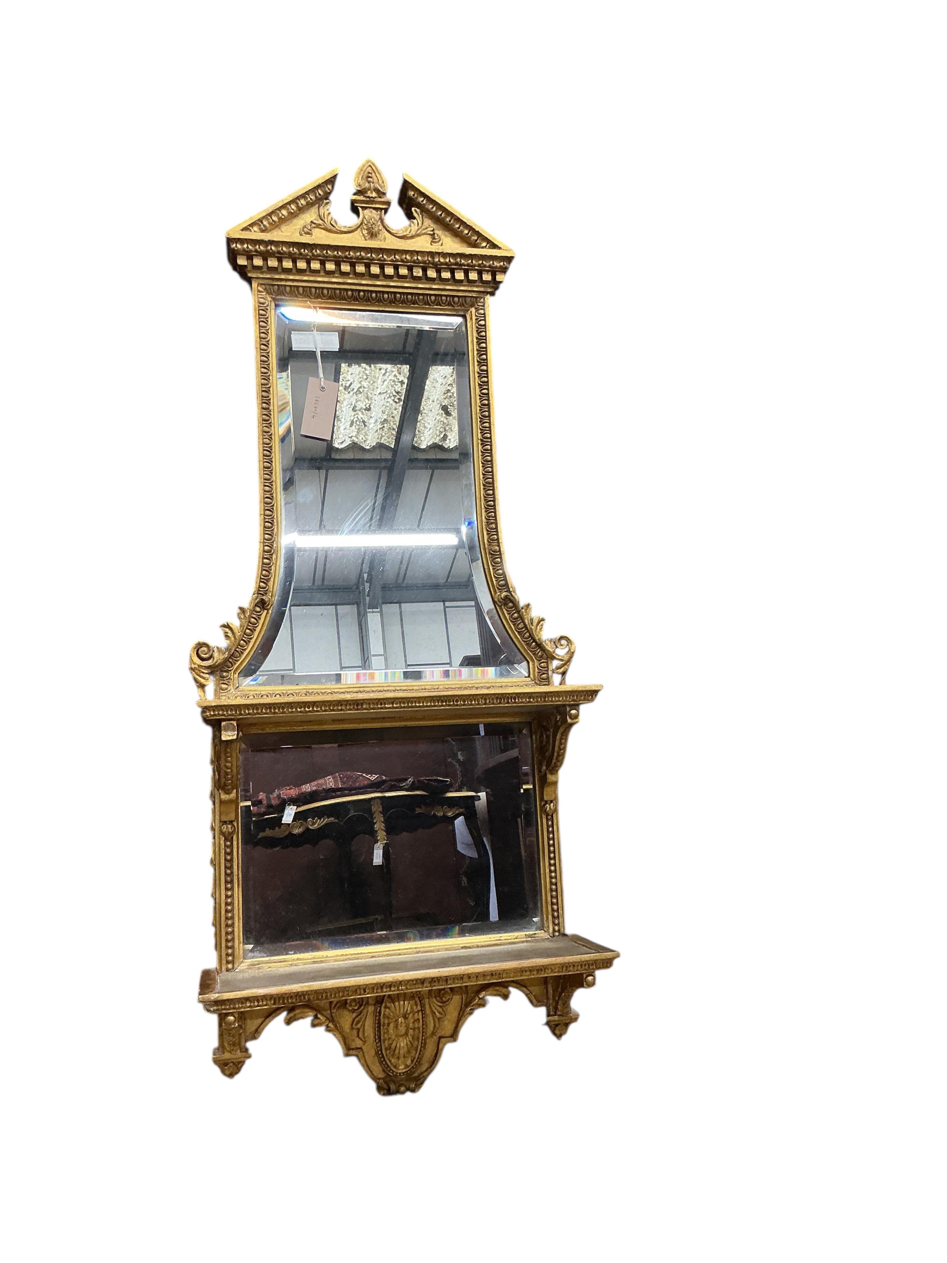 A 19th century giltwood and composition mirrored two tier wall bracket, width 44cm, height 108cm
